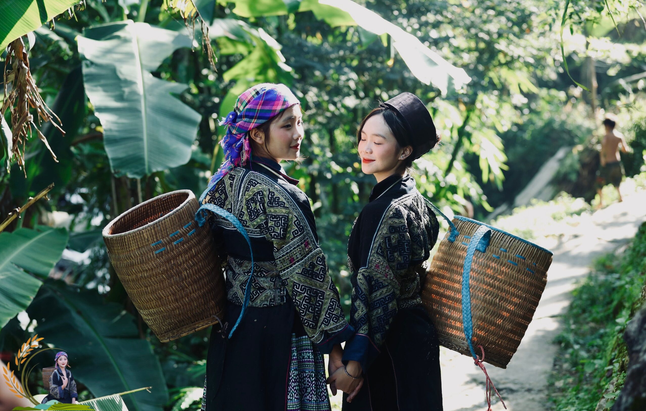 Two Hmong female tour guides walking on terraced rice fields in Sapa - Sapa Odyssey Tour
